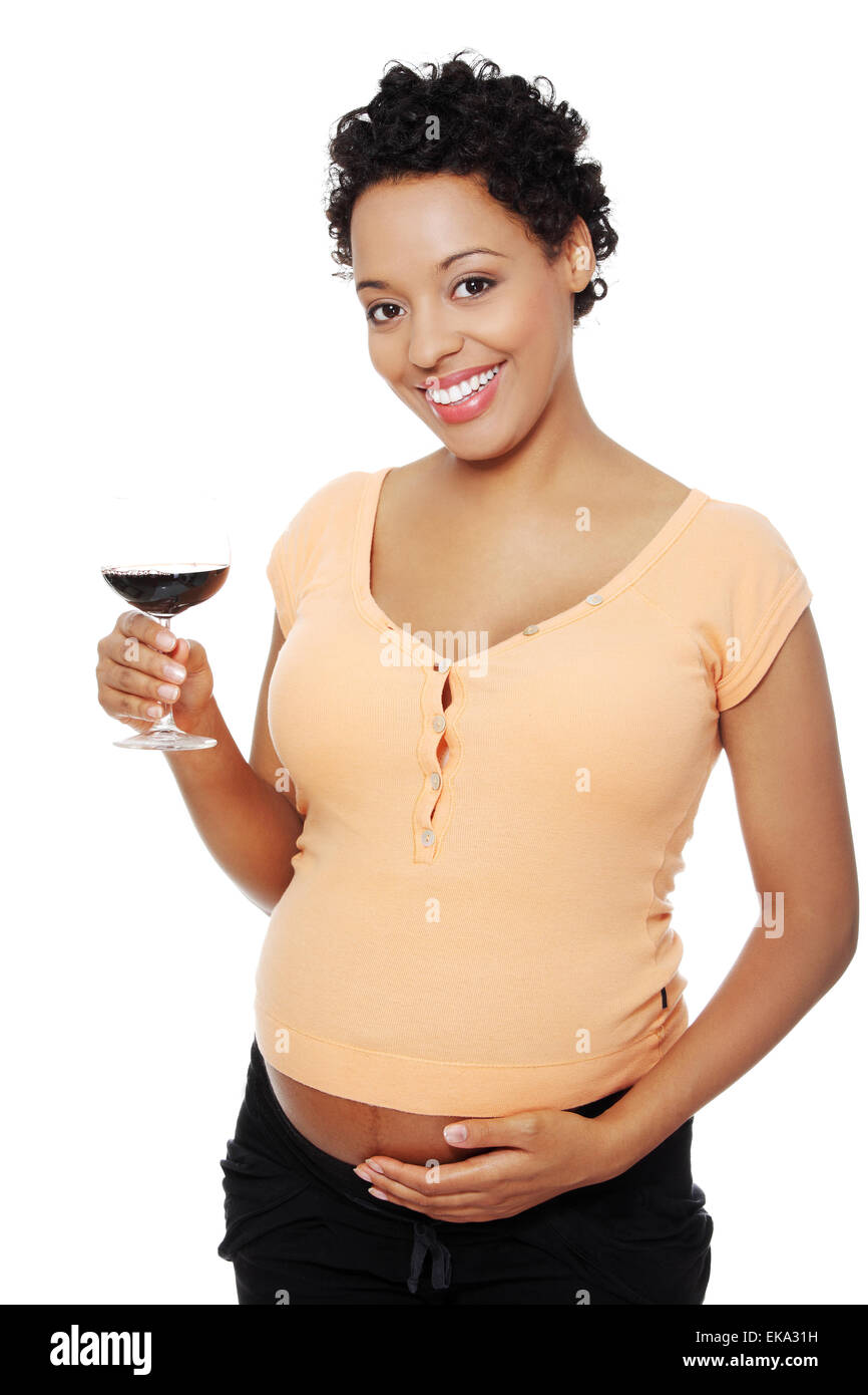 Pregnant woman holding glass wine Stock Photo Alamy