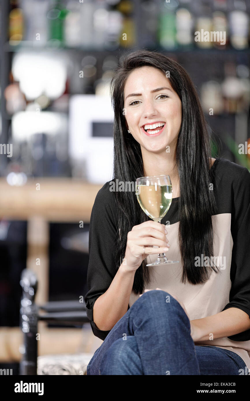 Woman relaxing in wine bar Stock Photo Alamy