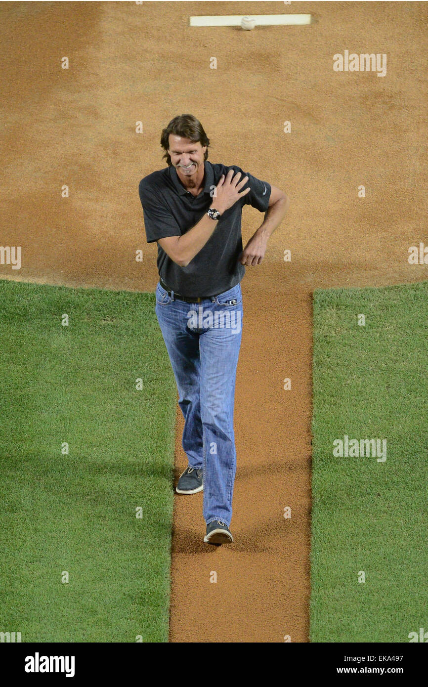 Dec. 7, 2011 - Glendale, Arizona, U.S - Retired baseball pitcher now  professional photographer Randy Johnson reviews his photos during a NFL  game against the Dallas Cowboys at University of Phoenix Stadium
