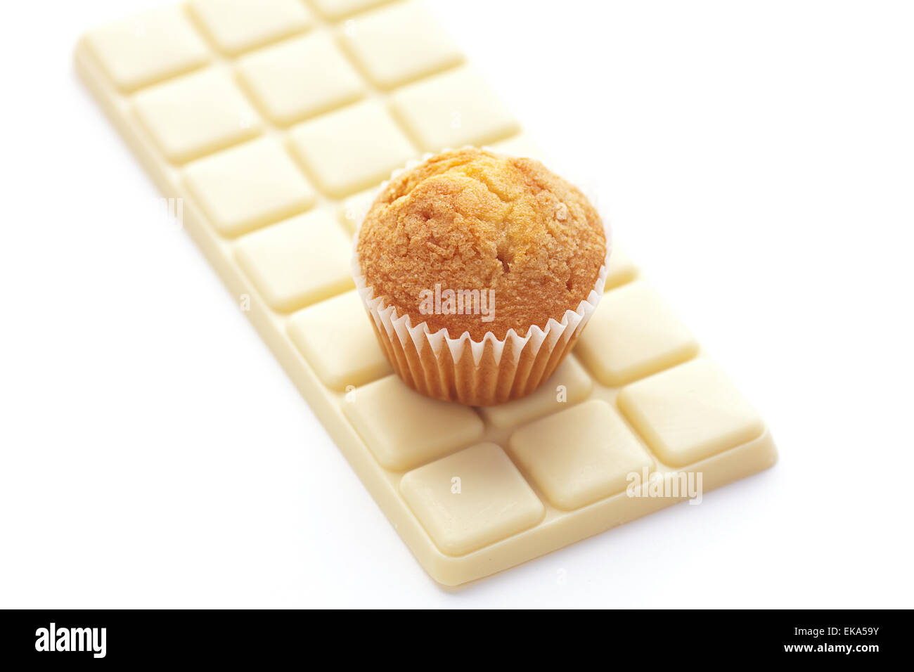 bar of white chocolate and muffin isolated on white Stock Photo