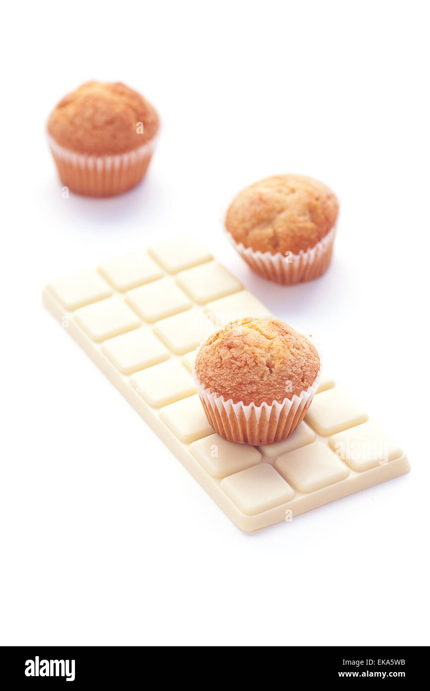 bar of white chocolate and muffin isolated on white Stock Photo