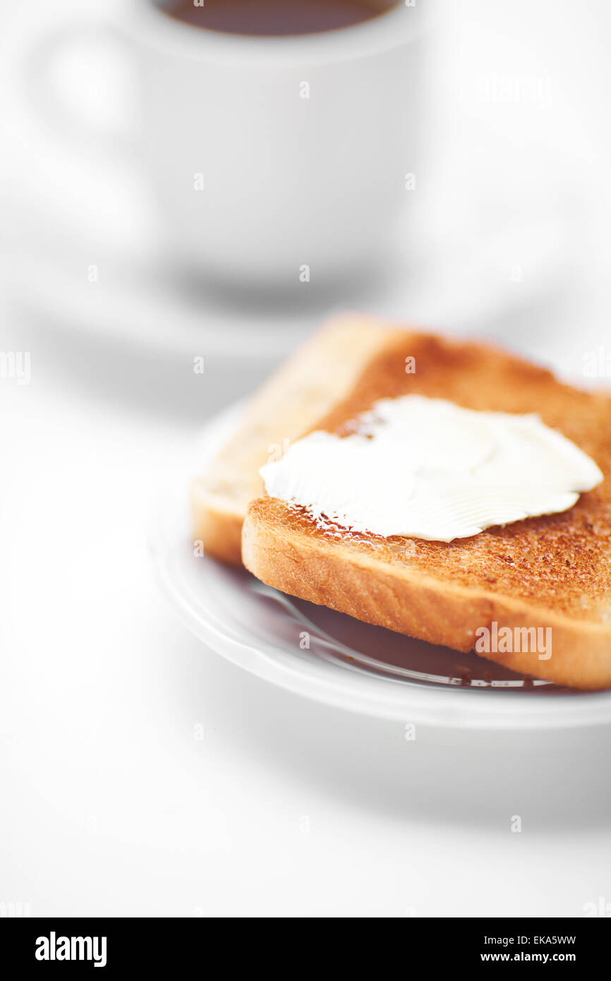tea and toast with butter isolated on white Stock Photo