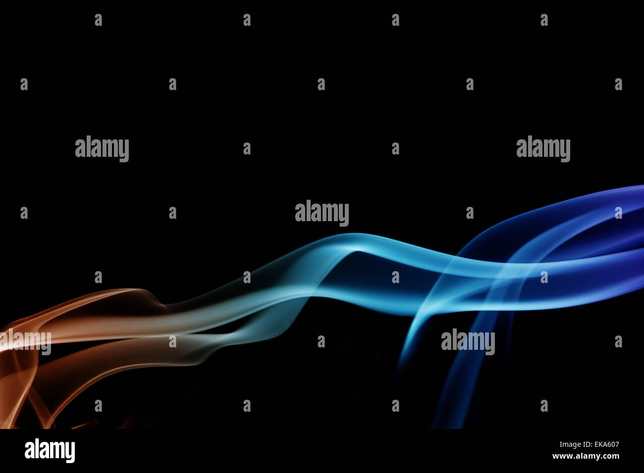 wave and smoke of different colors on black background Stock Photo