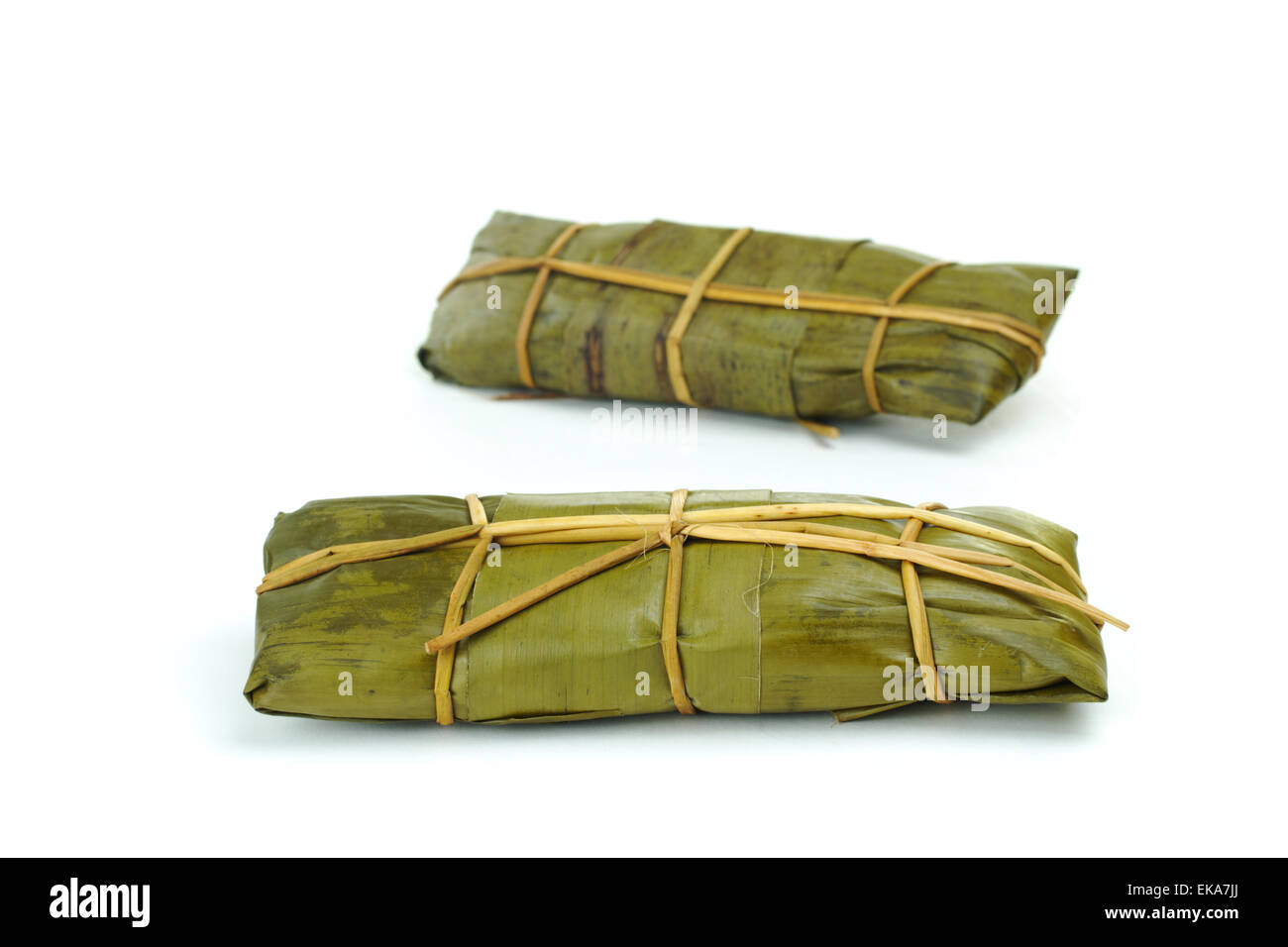 Peruvian tamales wrapped in banana leaves (Selective Focus Stock Photo