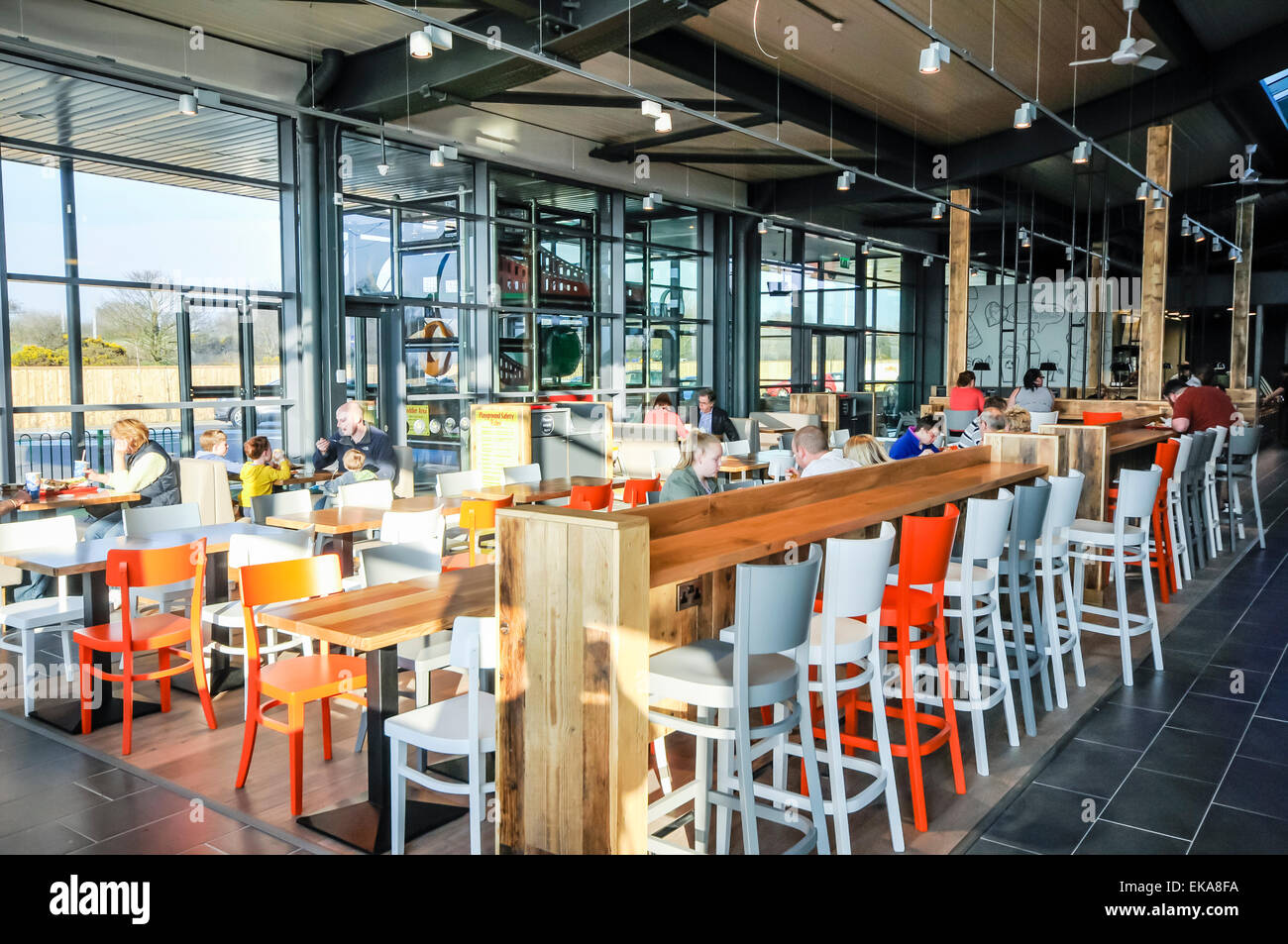 Seating area of a cafe in a motorway service station Stock Photo Alamy