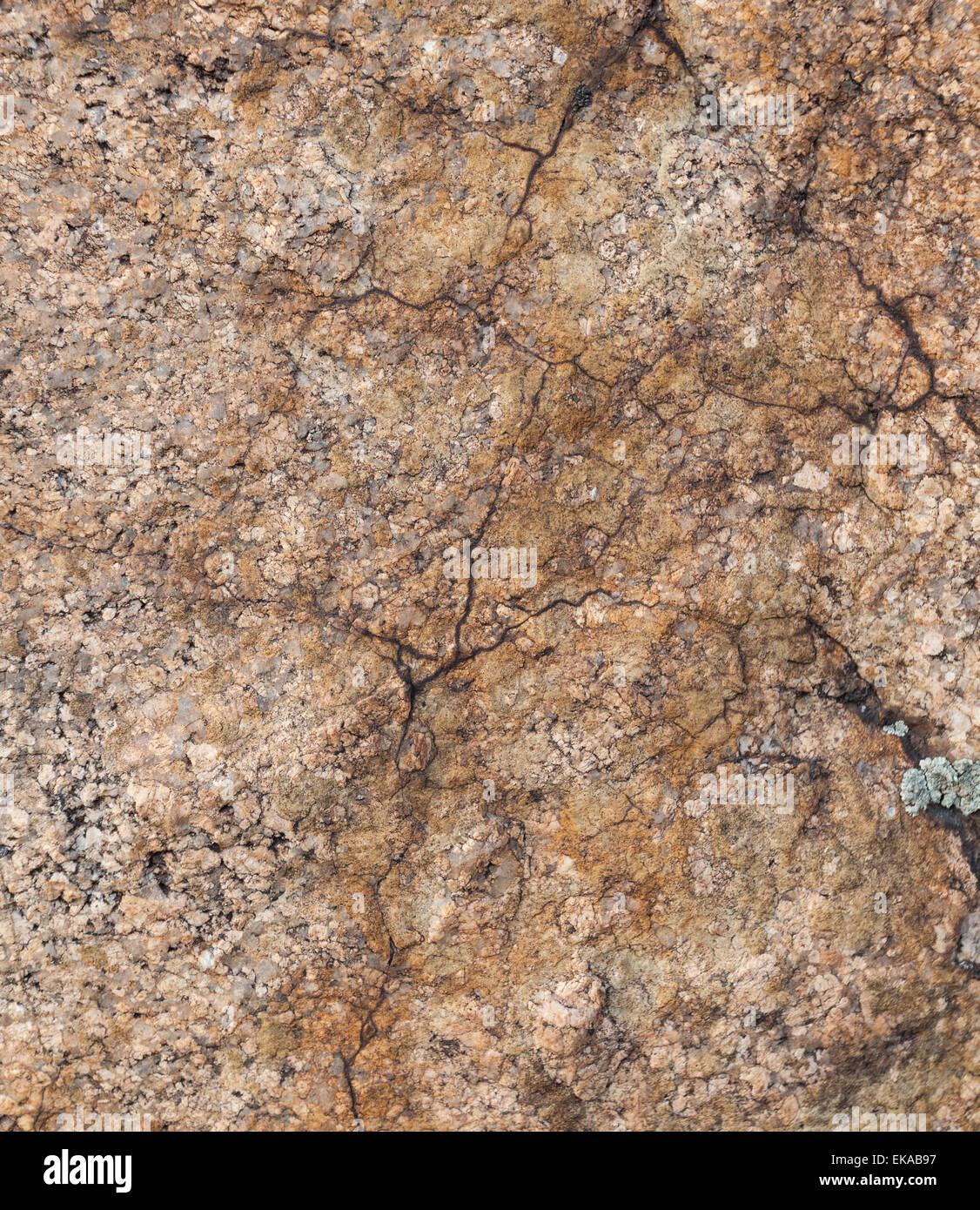 Natural granite stone texture background. Rough and rusty. Close-up