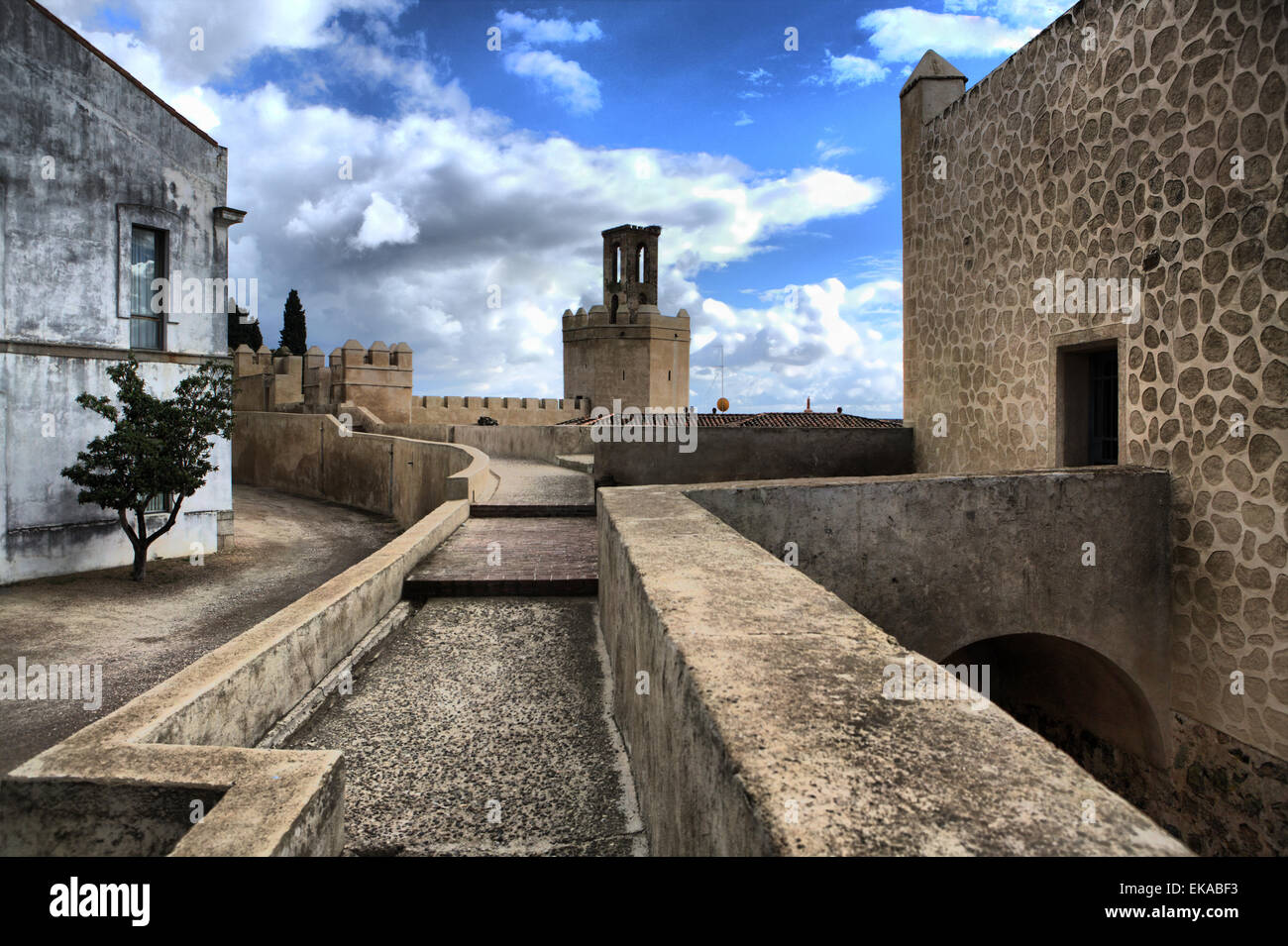 Battlements, pathways and towers of Badajoz muslim wall. Adarve and inside buildings. HDR Stock Photo