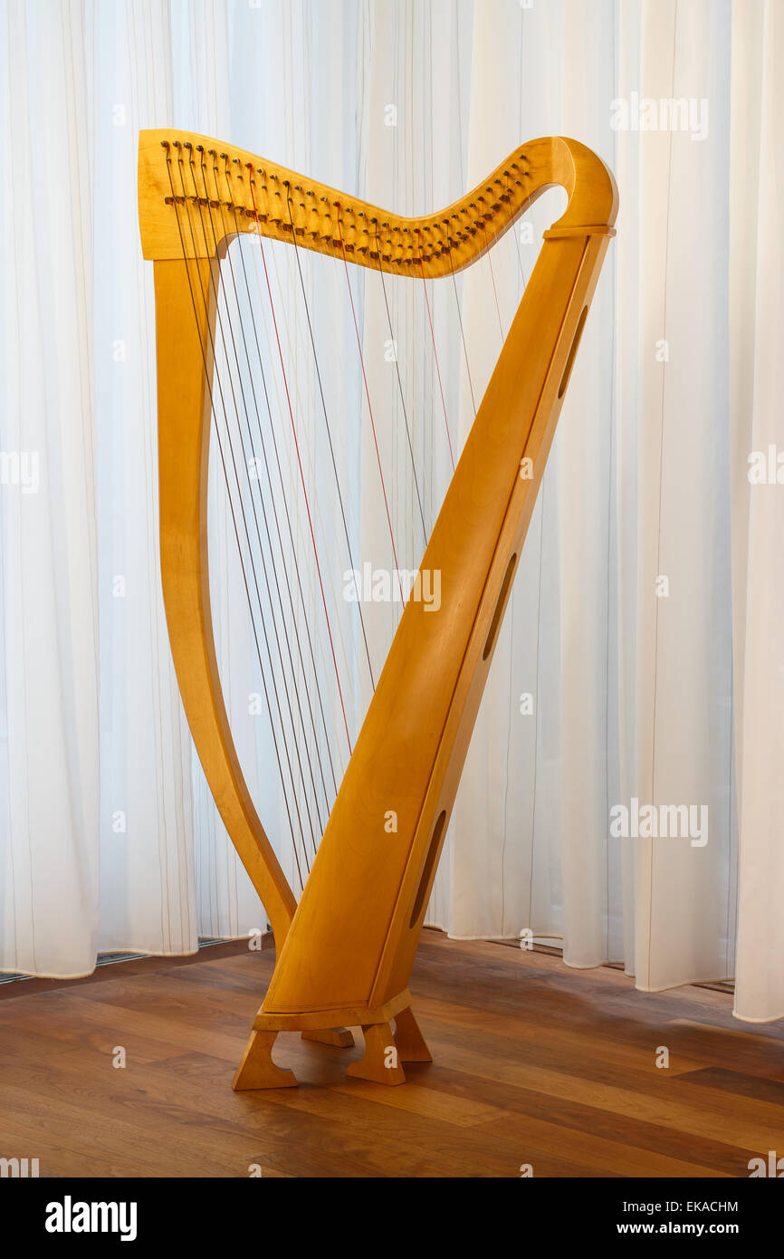 A celtic harp with strings standing. Ready to play Stock Photo Alamy