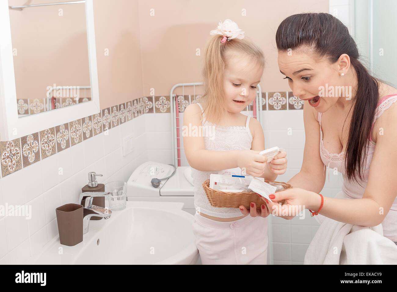 Mother and daughter in bathroom Stock Photo - Alamy