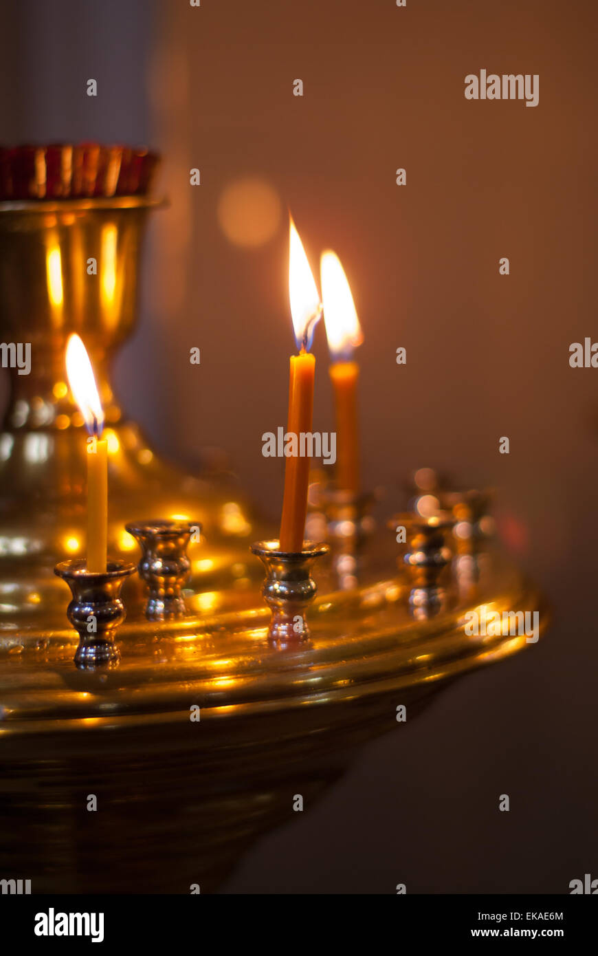 candles burn on a church altar Stock Photo Alamy