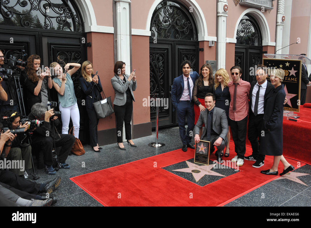 LOS ANGELES, CA - MARCH 11, 2015: Actor Jim Parsons & Big Bang Theory co-stars Kunal Nayyar (left), Mayim Bialik, Melissa Rauch, Simon Helberg, Johnny Galecki & Kaley Cuoco-Sweeting on Hollywood Blvd where Parsons is honored with the 2,545th star on the Hollywood Walk of Fame. Stock Photo