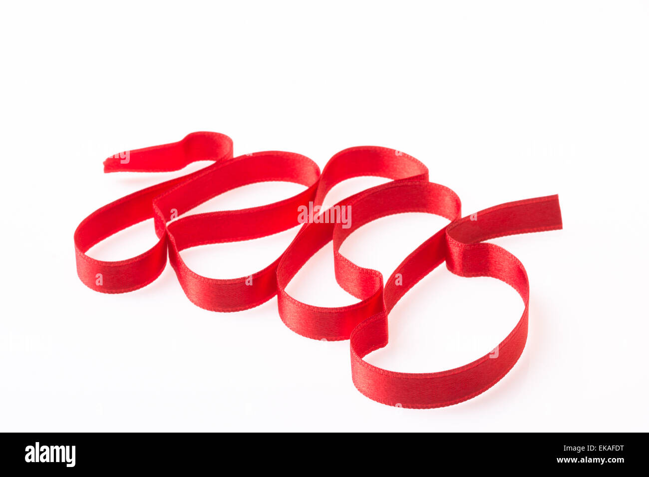 Red silk twisted ribbon in the form Stock Photo