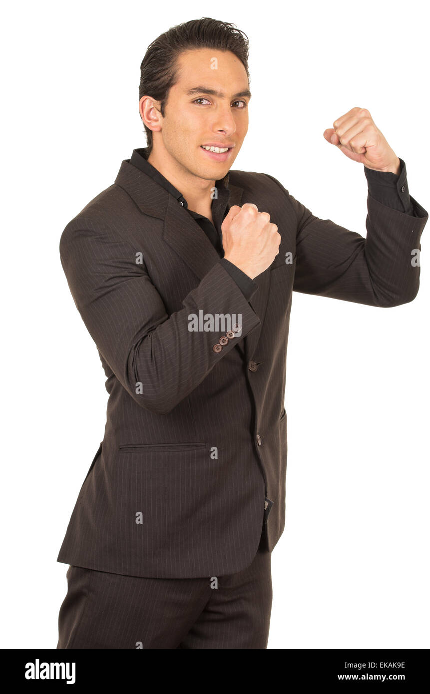 handsome young man wearing a suit posing with fists up gesturing fight ...