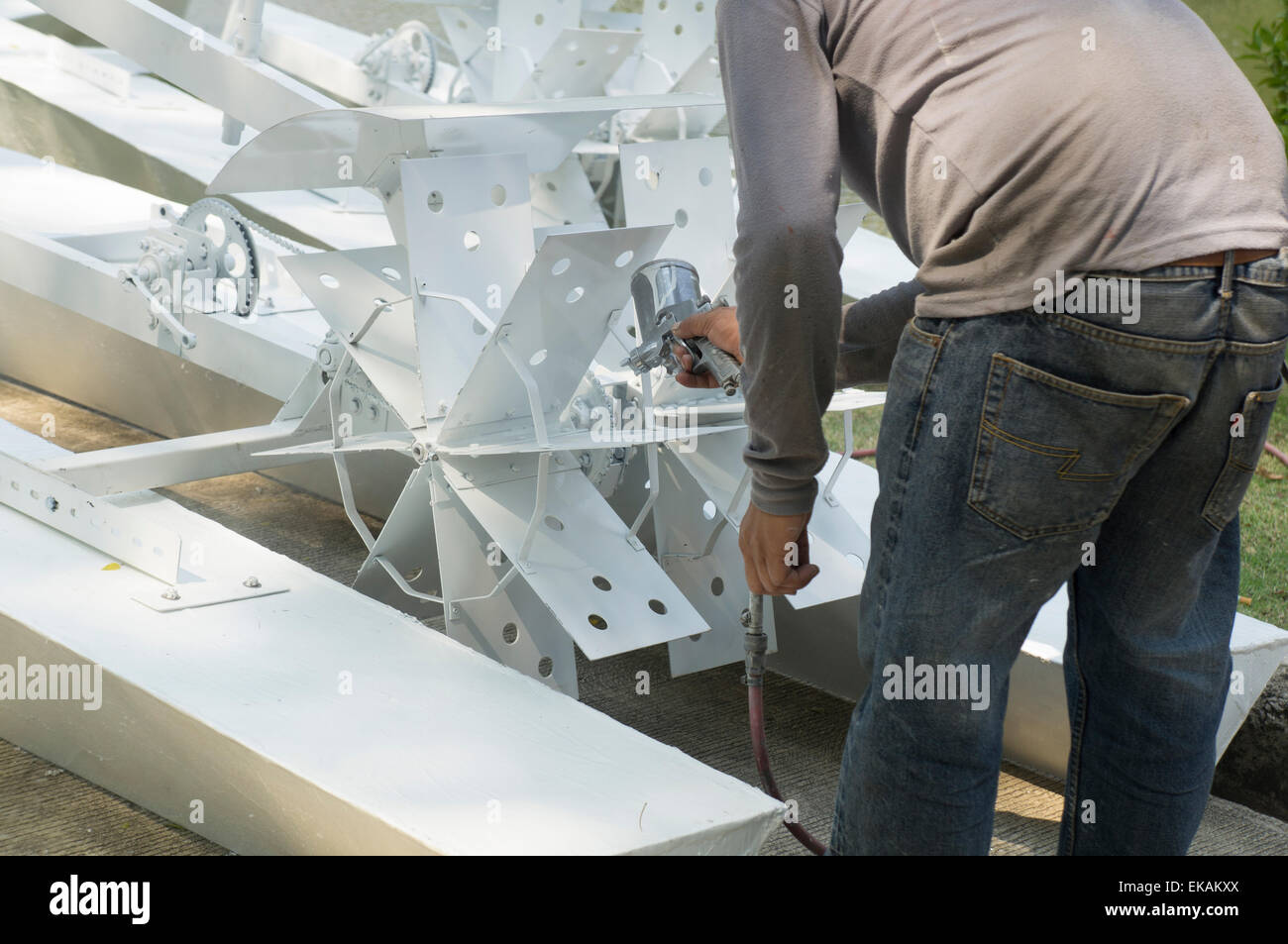man work mechanic bicycle gear fix painting spray Stock Photo Alamy