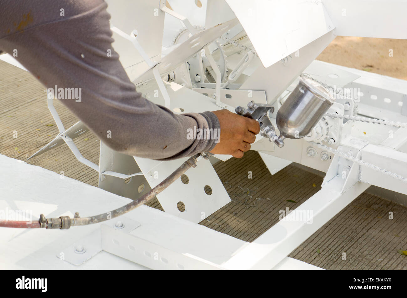 man work mechanic bicycle gear fix painting spray Stock Photo Alamy