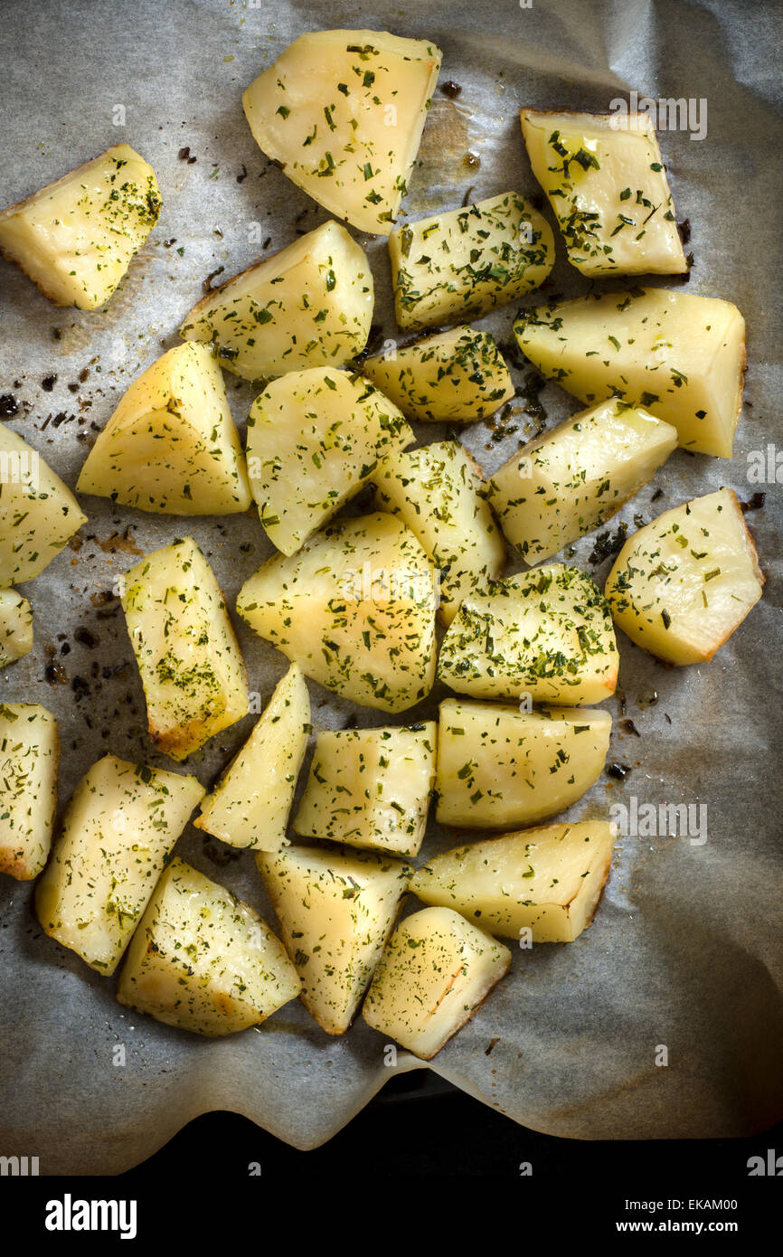 Baked yellow potatoes with chive on top Stock Photo Alamy