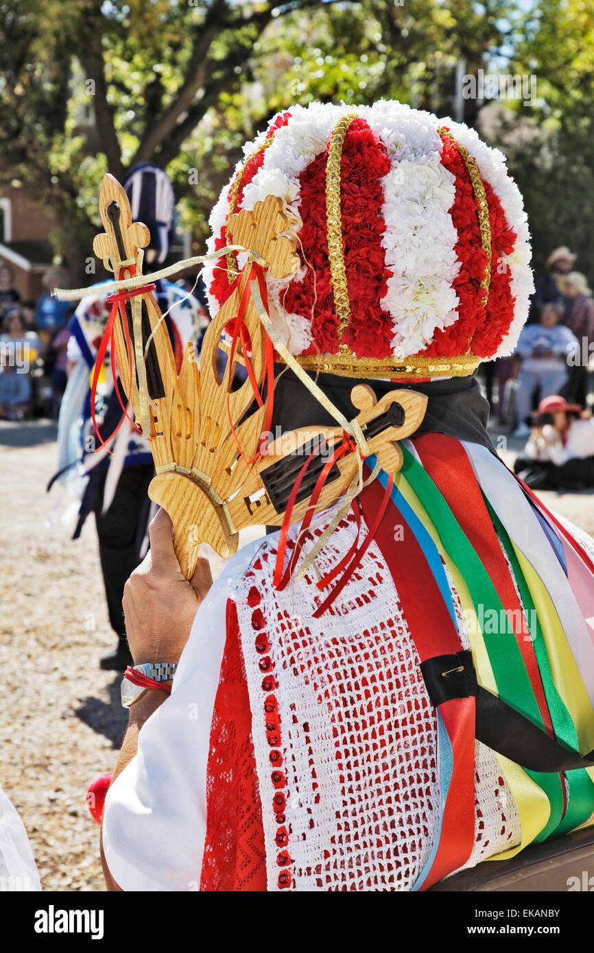A Matachine portraying the leader or Monarcha holds his trident while watching the  other dancers at the 2009 Fall Fiesta Stock Photo