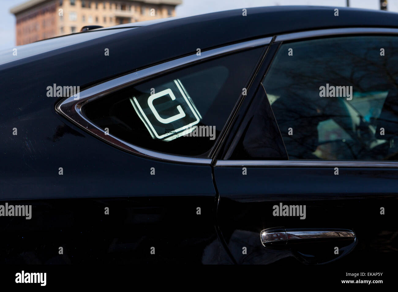 Uber sign on car window - USA Stock Photo