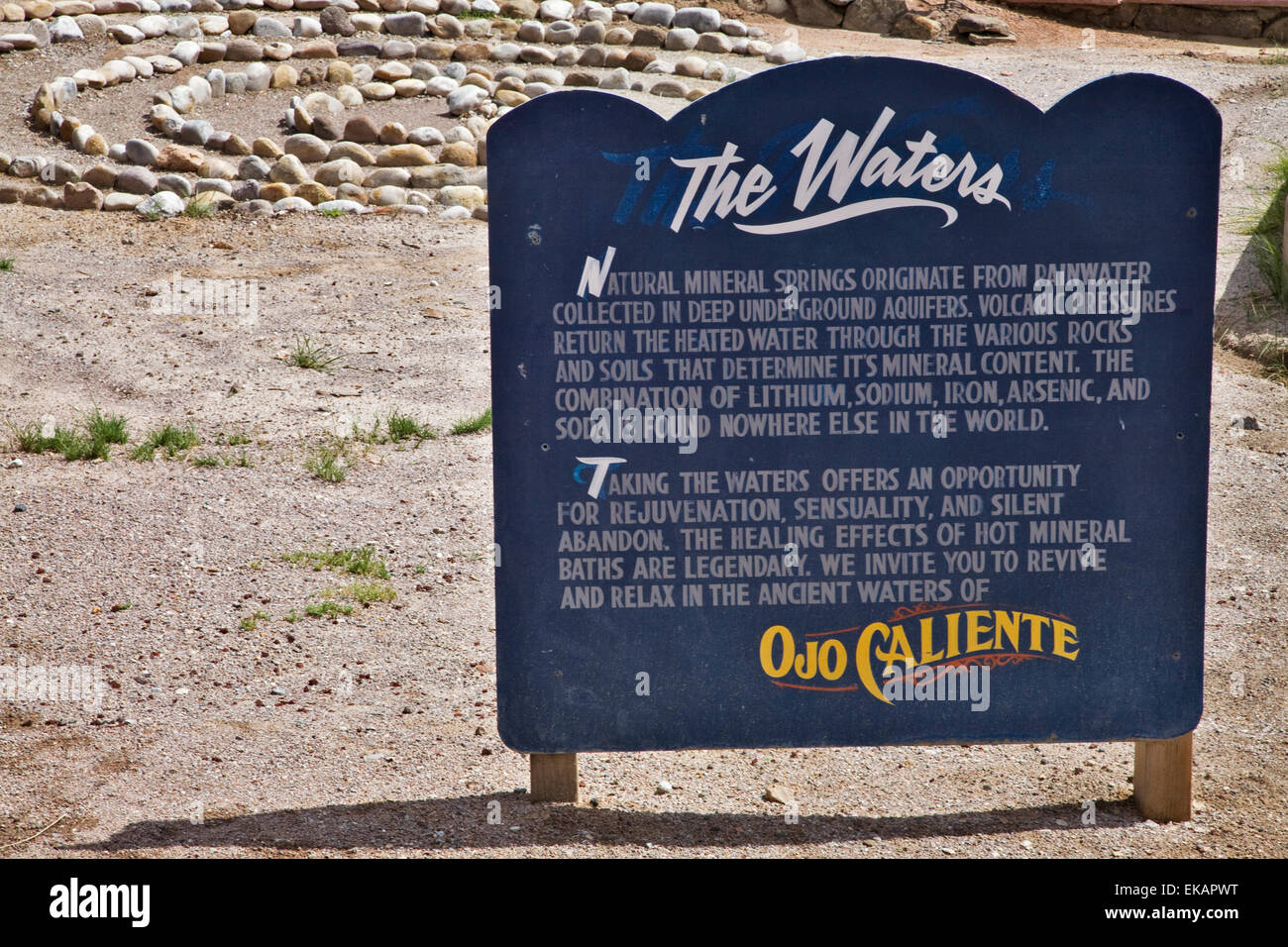 The  history and details of the Ojo Caliente Mineral Springs Resort and Spa in northern New Mexico  is described on a sign. Stock Photo