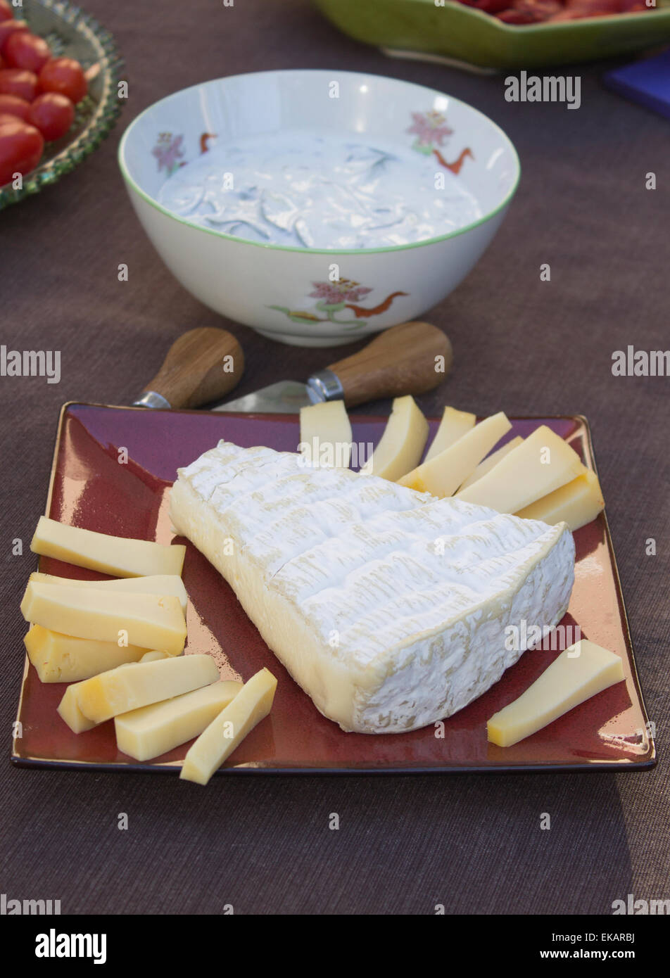 Deviled eggs served with Gouda and Brie Cheeses, topped with black
