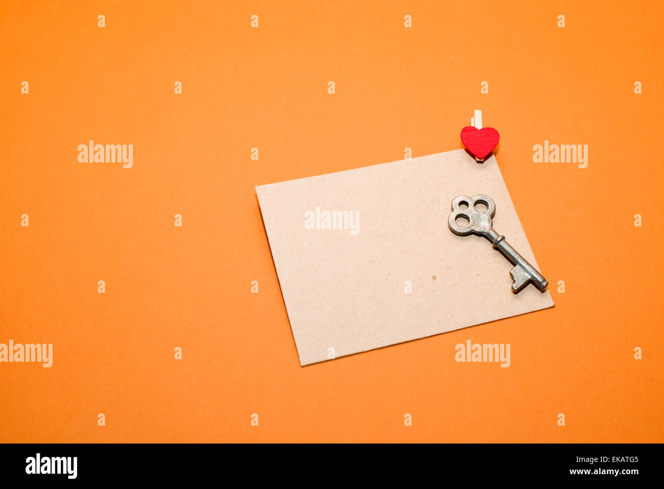 Mailing Envelope with heart and key on a orange background Stock Photo