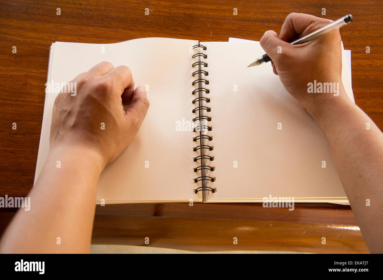 man working table book pen booklet top Stock Photo Alamy