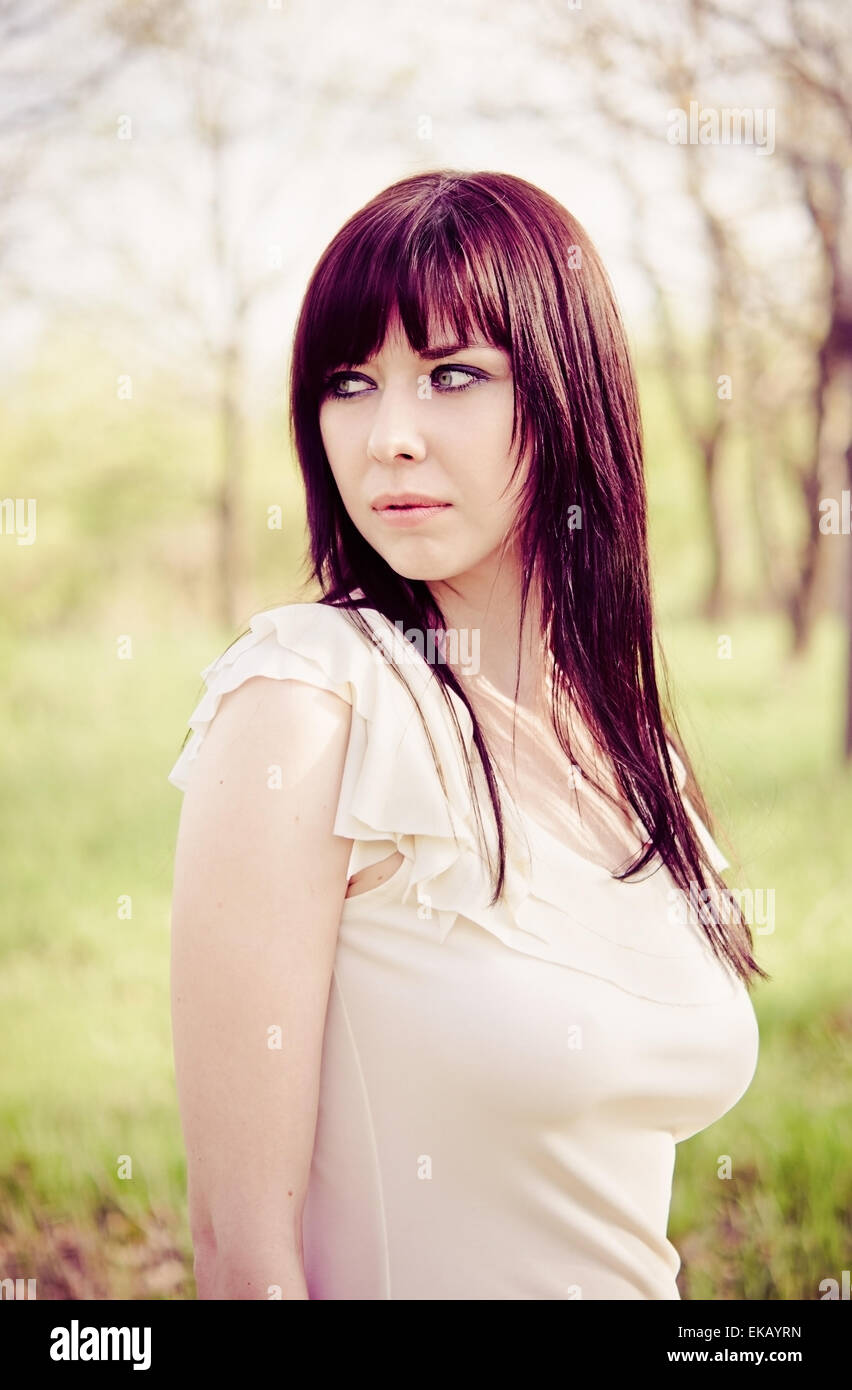 Portrait of beautiful young girl in the park Stock Photo - Alamy