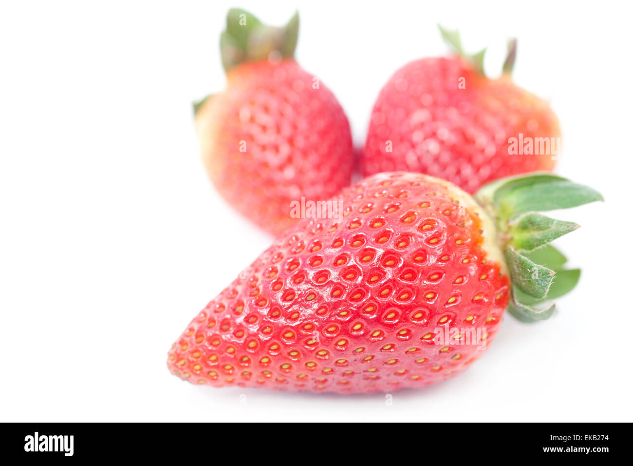 big red strawberries isolated on white Stock Photo - Alamy
