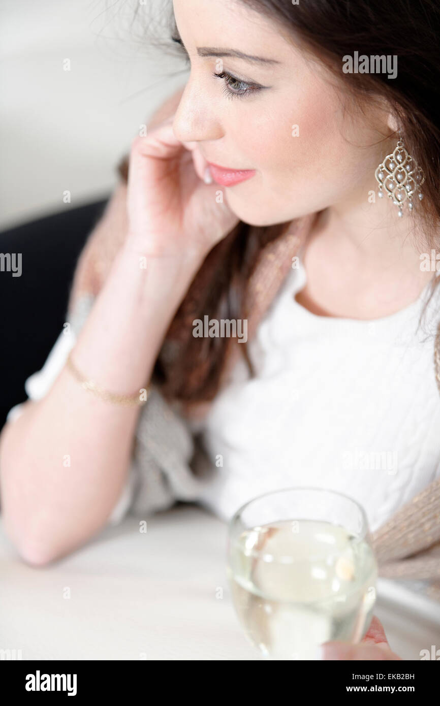 Woman enjoying a glass of wine Stock Photo - Alamy