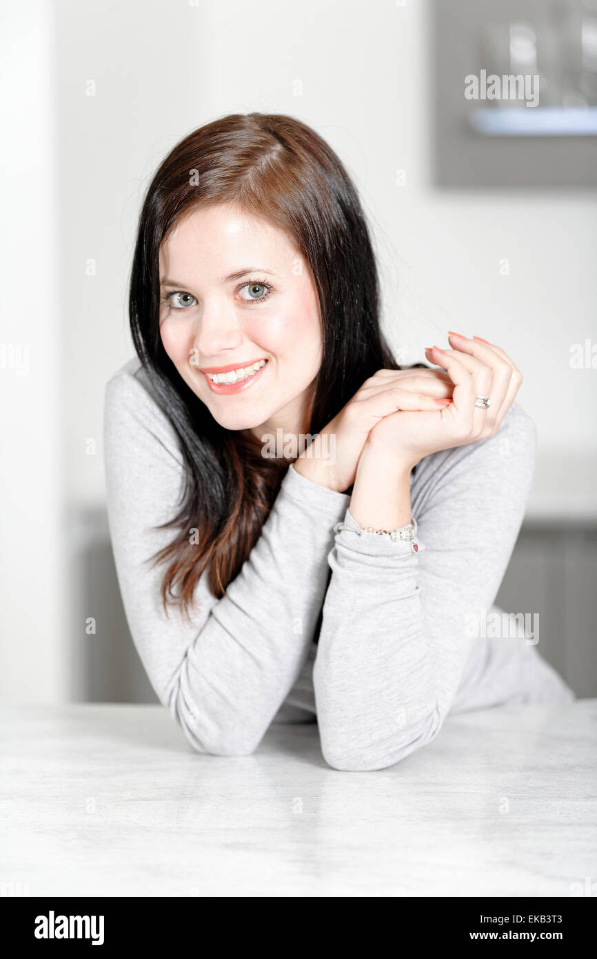 Woman in a white kitchen Stock Photo Alamy