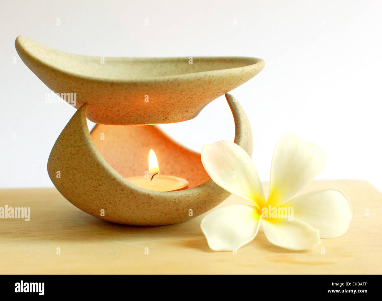 Aromatherapy lamp with flower and candle Stock Photo Alamy