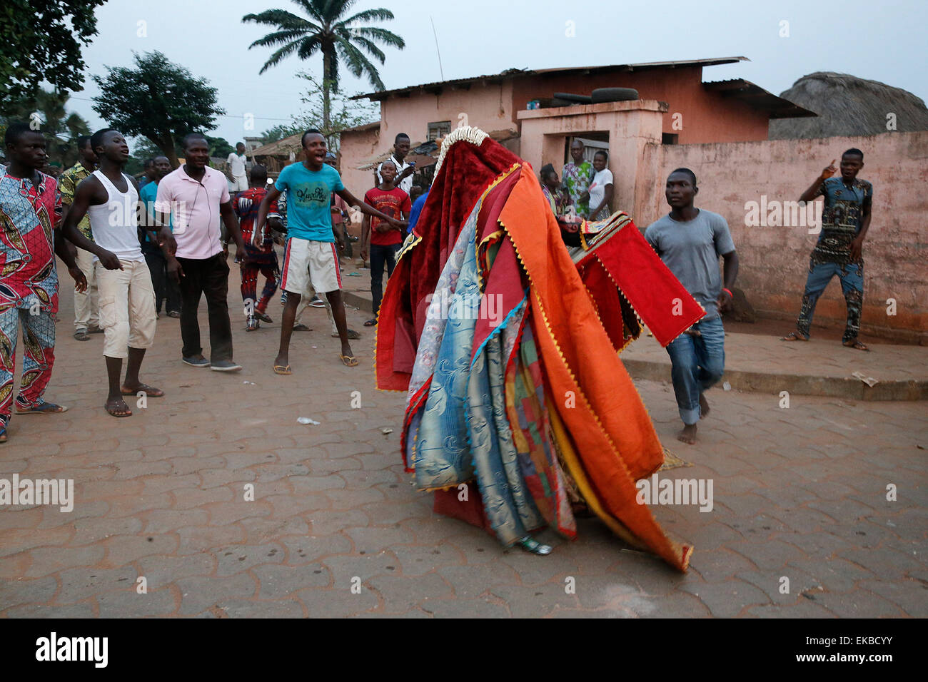 People keeping their distance as it's dangerous to touch the egoun-egoun, Feast of the Ghosts in Ouidah, Benin Stock Photo