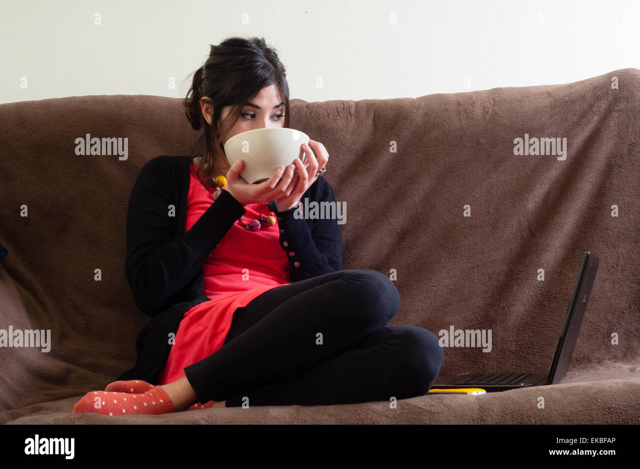 woman at home using notebook Stock Photo - Alamy