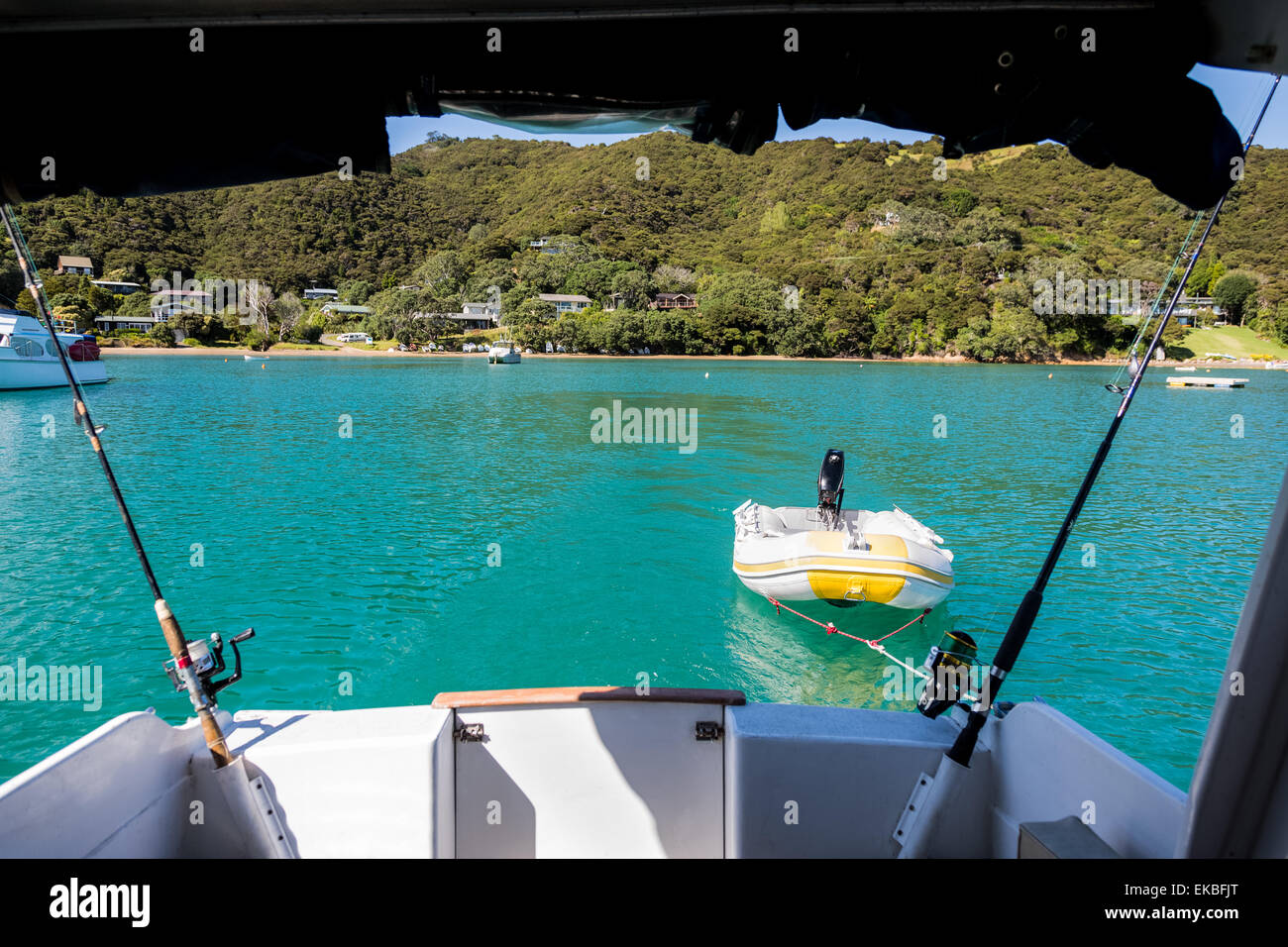 View from the back of a boat as it heads out to sea in the Bay of Islands, New Zealand. Stock Photo