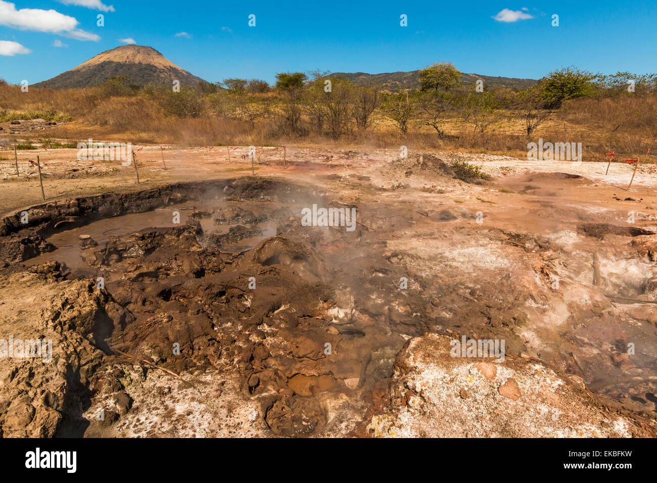 Mud pots, fumaroles and dormant Volcan Santa Clara at the San Jacinto volcanic thermal area north of Leon, Leon, Nicaragua Stock Photo