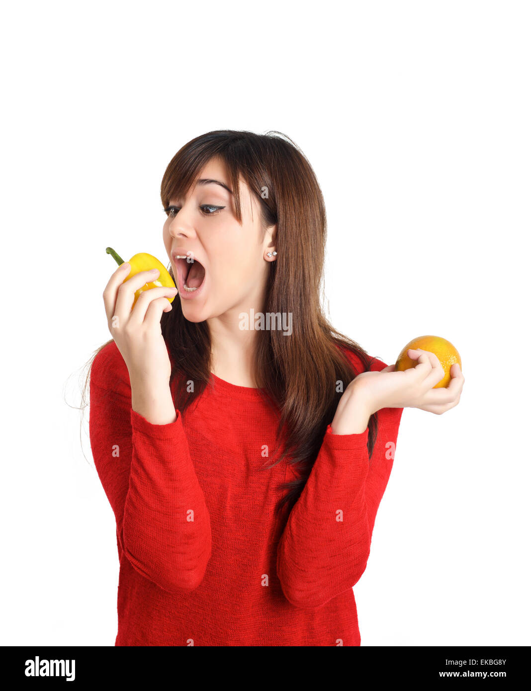 Beautiful mixed Asian girl biting fruits and vegetable Stock Photo