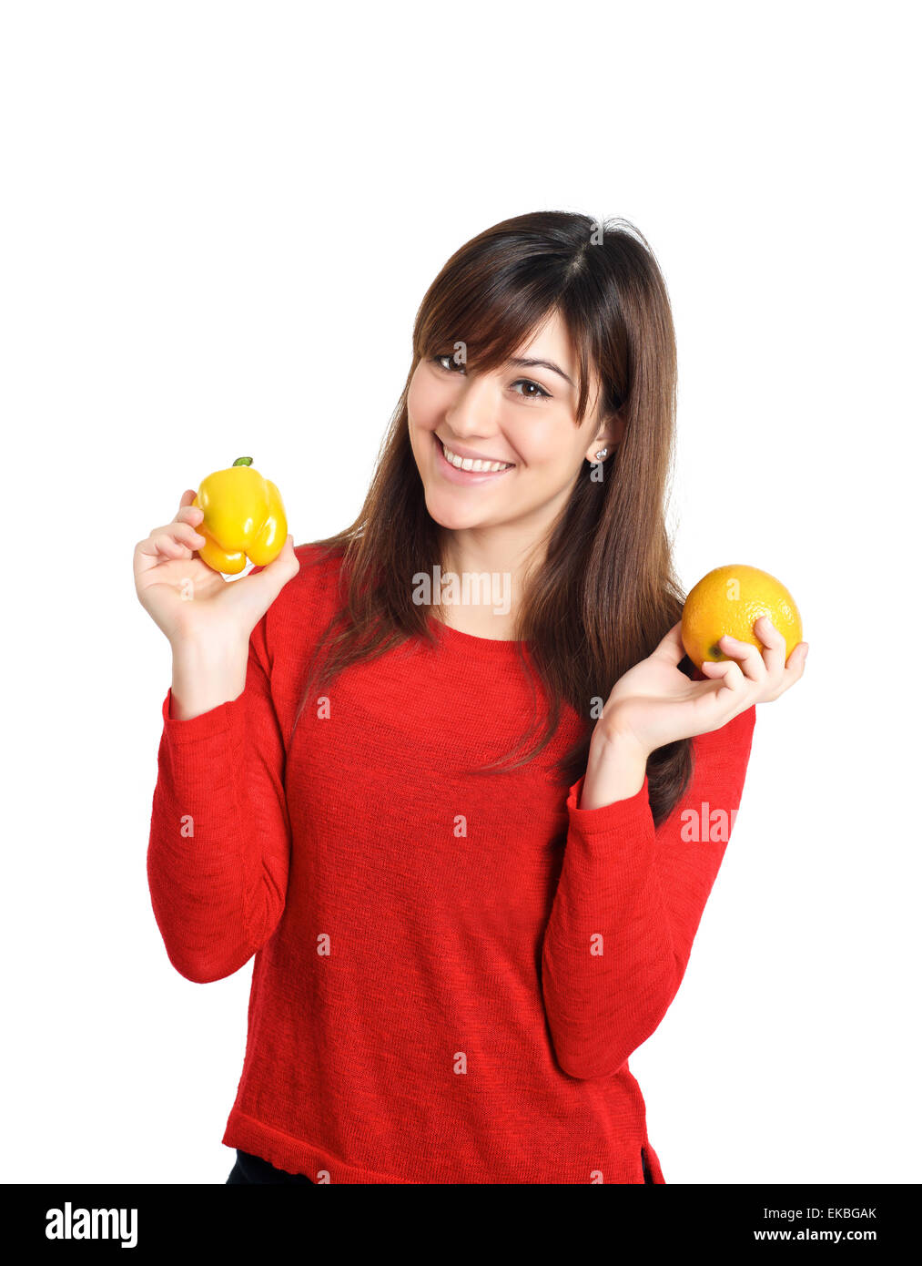 Beautiful mixed Asian girl holding fruits and vegetable Stock Photo