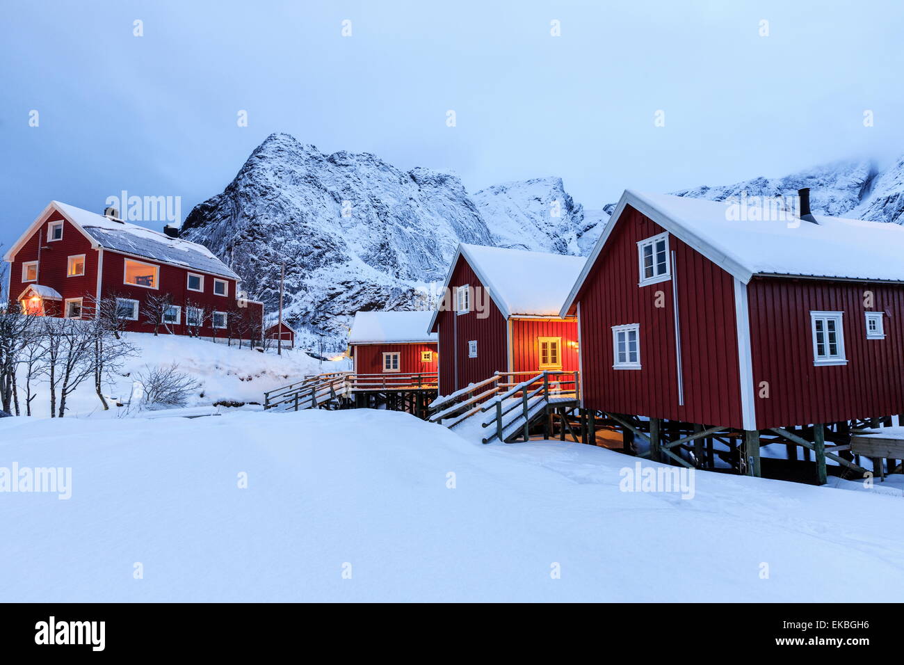 Fresh snow on the typical Norwegian homes, the Rorbu, once fishermen's home, now tourist accommodation, Lofoten Islands, Norway Stock Photo