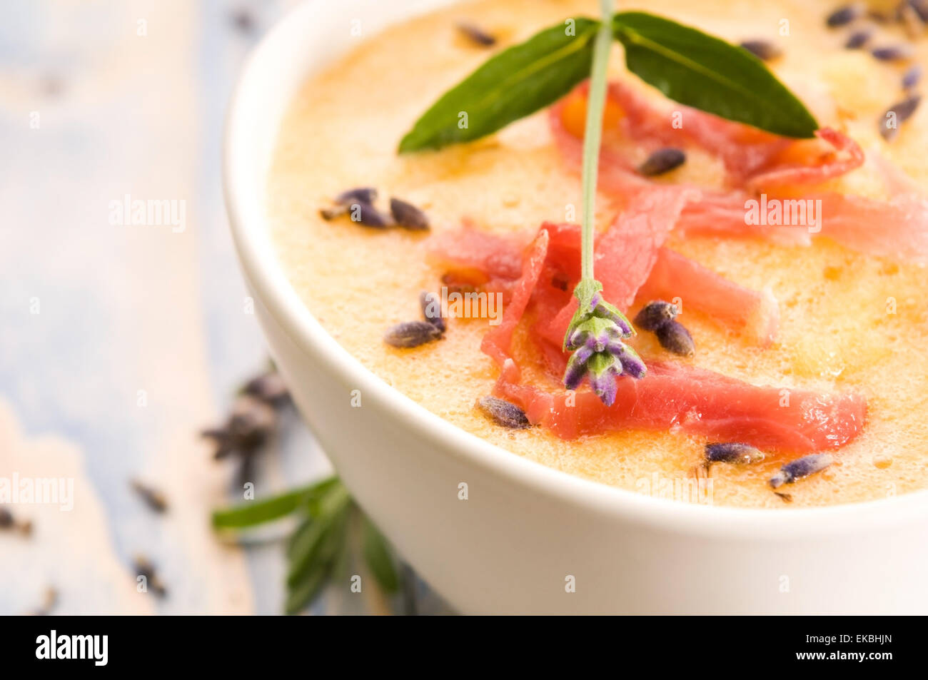 fresh melon soup with parma ham and lavender flower Stock Photo