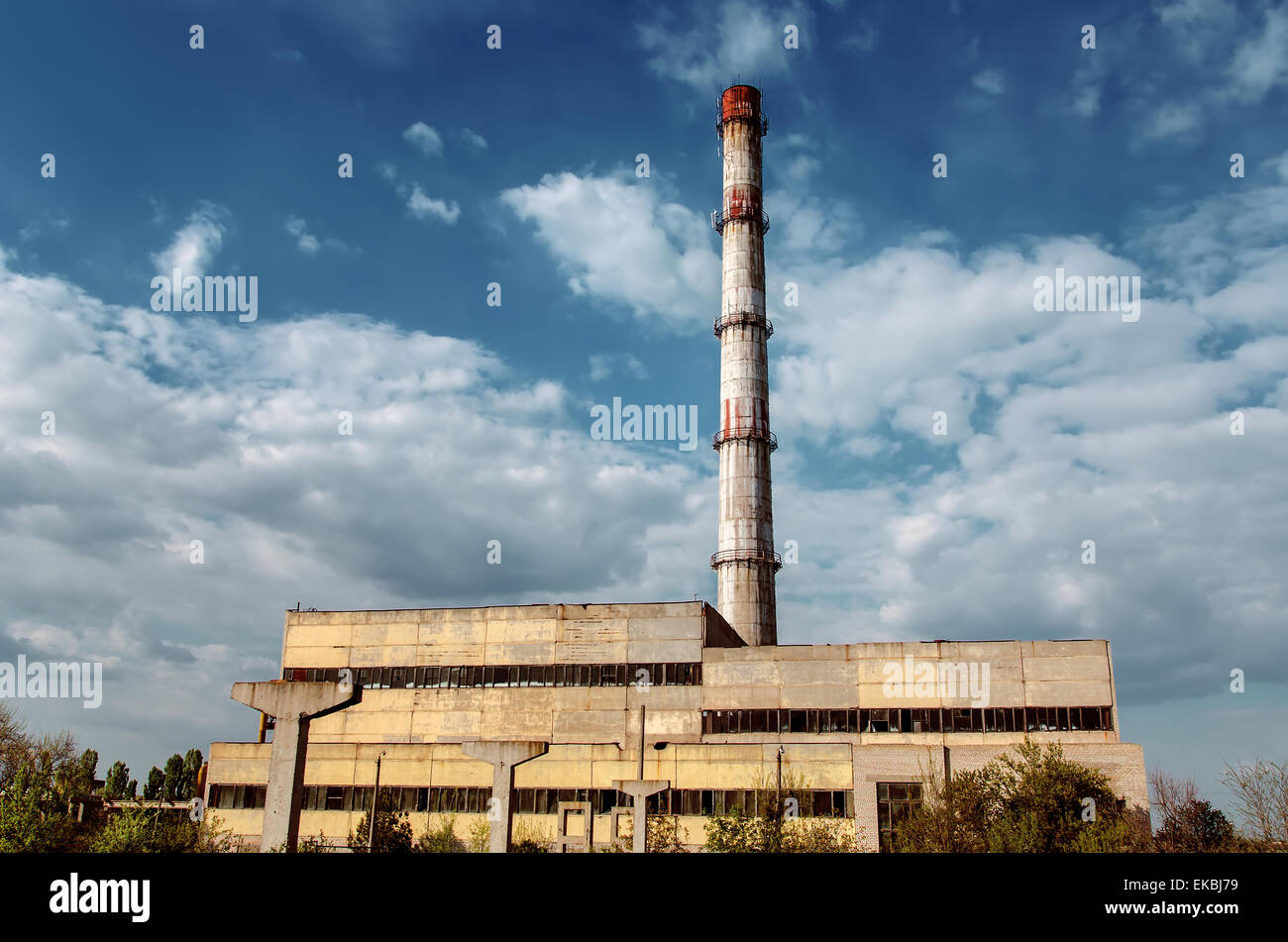 old factory smokestack tube against cloudy sky Stock Photo Alamy
