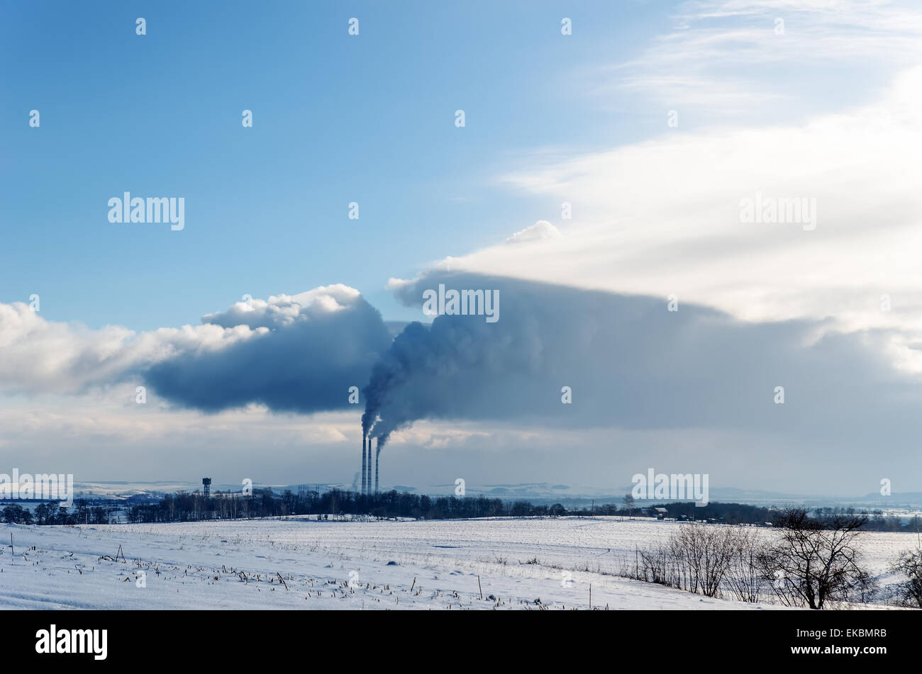 smokestack pollutions in sky. winter time Stock Photo
