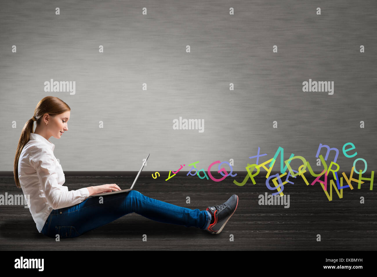 young girl sitting on the floor with a laptop Stock Photo - Alamy