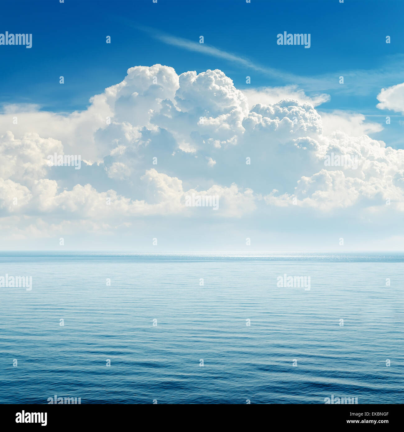 blue sea and cloudy sky over it Stock Photo - Alamy