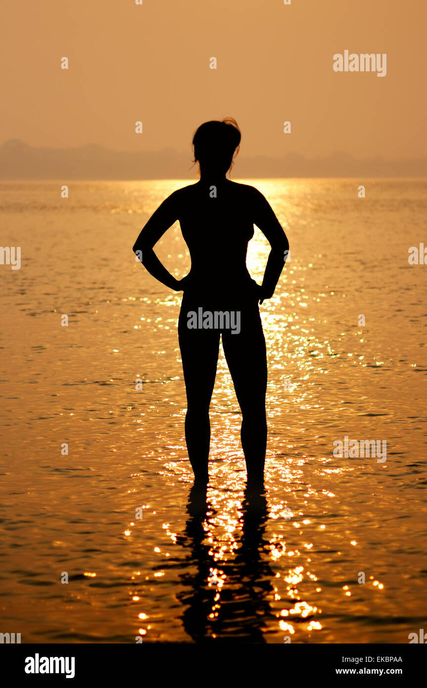 Silhouette woman in sea hi-res stock photography and images - Alamy