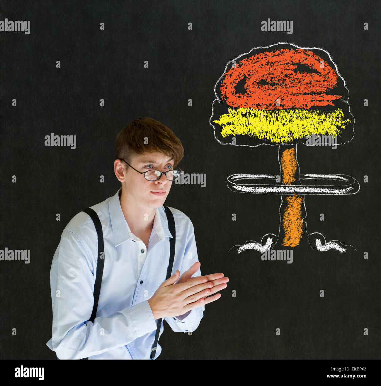 Evil or sneaky man thinking chalk nuclear bomb cloud blackboard background Stock Photo