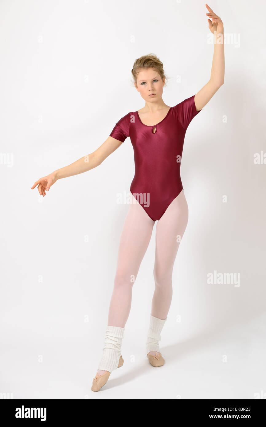 Ballett girl wearing leotard and tights doing basic exercises Stock Photo -  Alamy