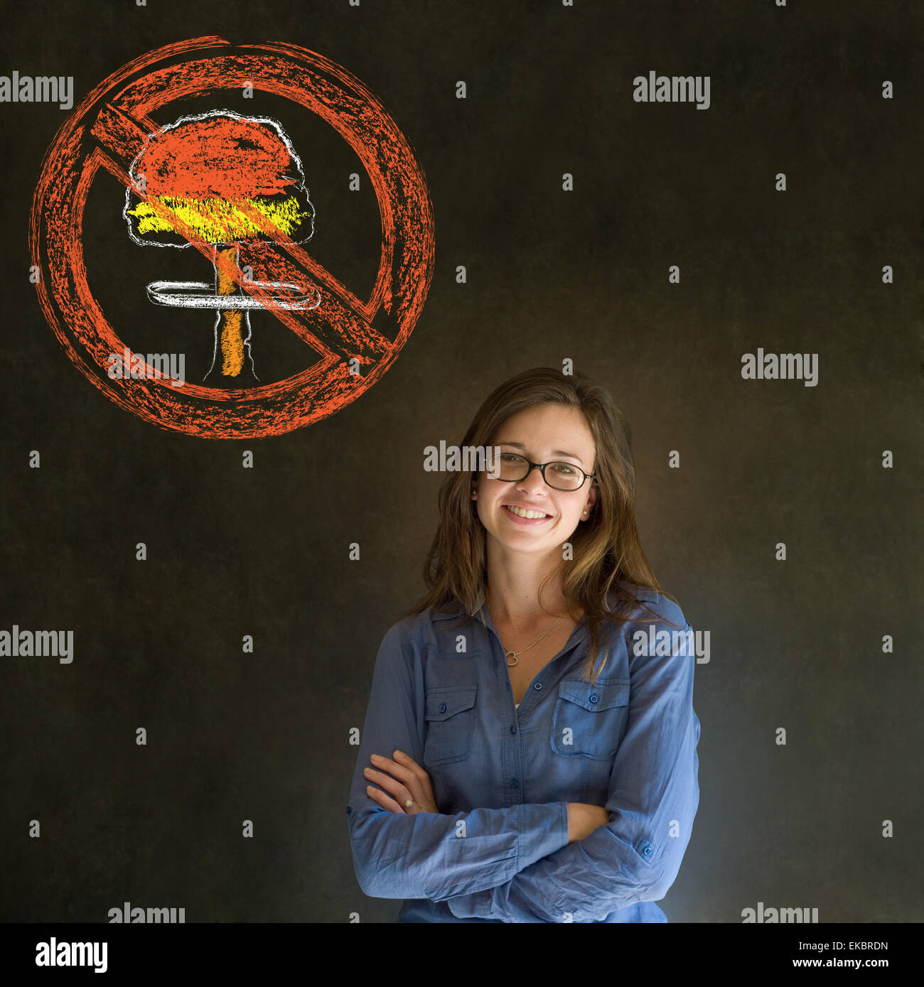 No nuclear war pacifist business woman, student, teacher or politician on blackboard background Stock Photo