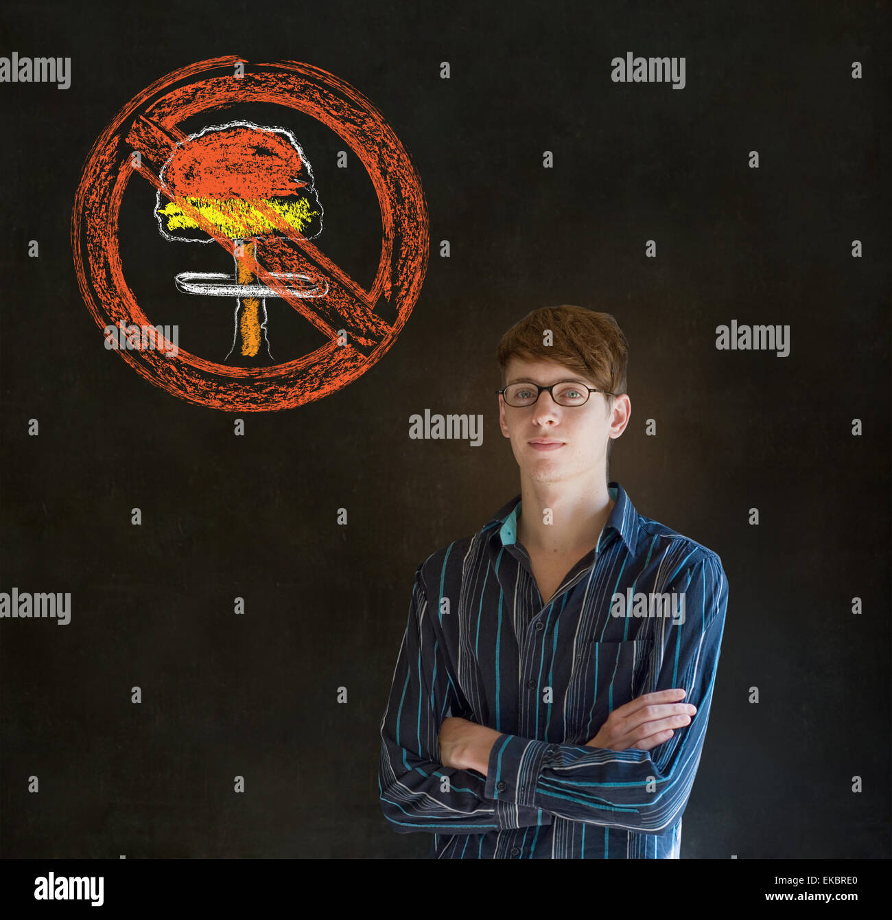 No nuclear war pacifist business man, student, teacher or politician on blackboard background Stock Photo