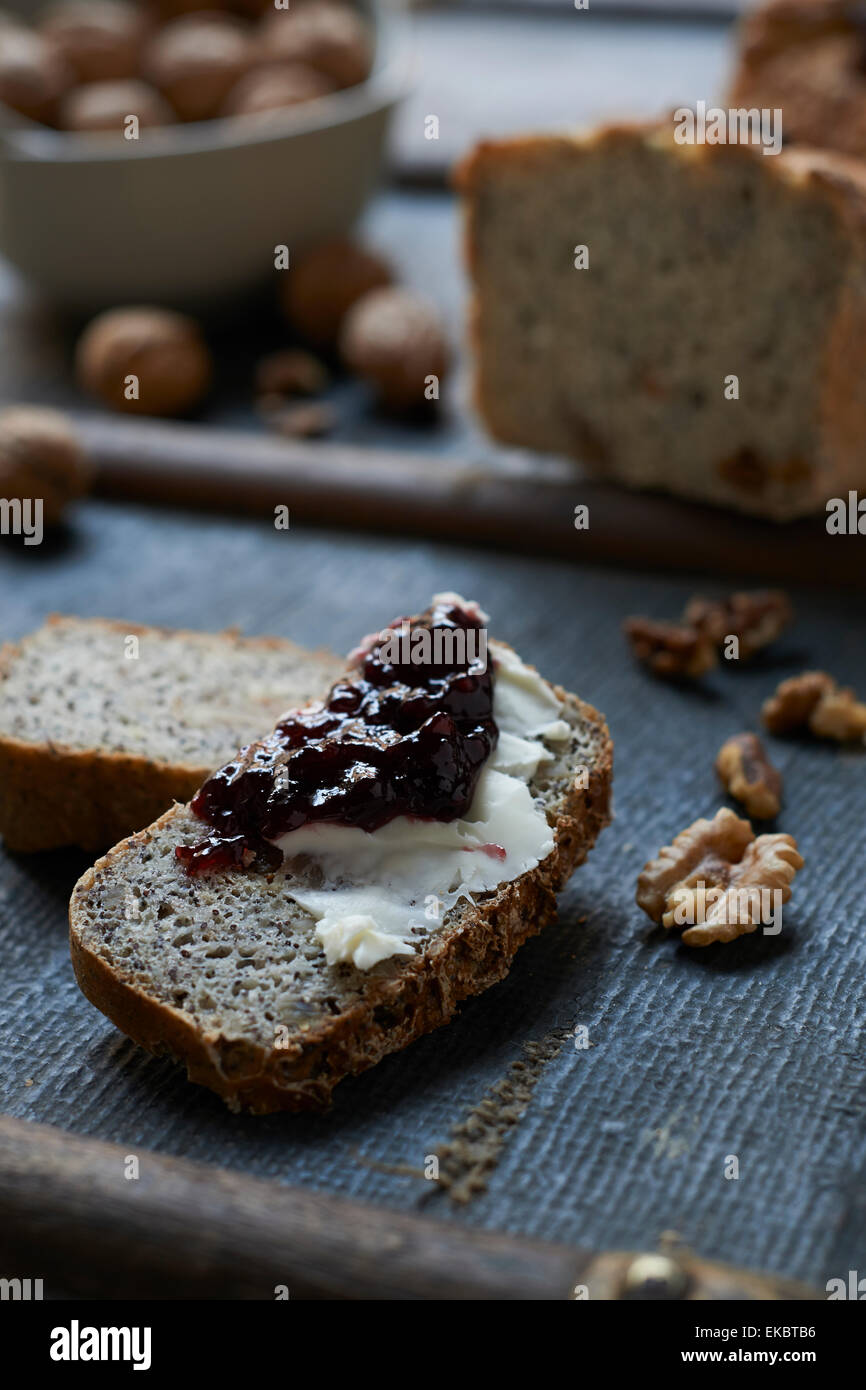 Glutenfree bread, jam, cream cheese and walnuts Stock Photo Alamy