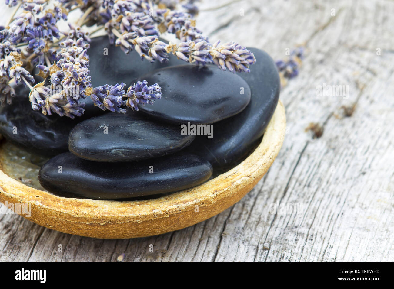 massage stones and dried lavender Stock Photo Alamy
